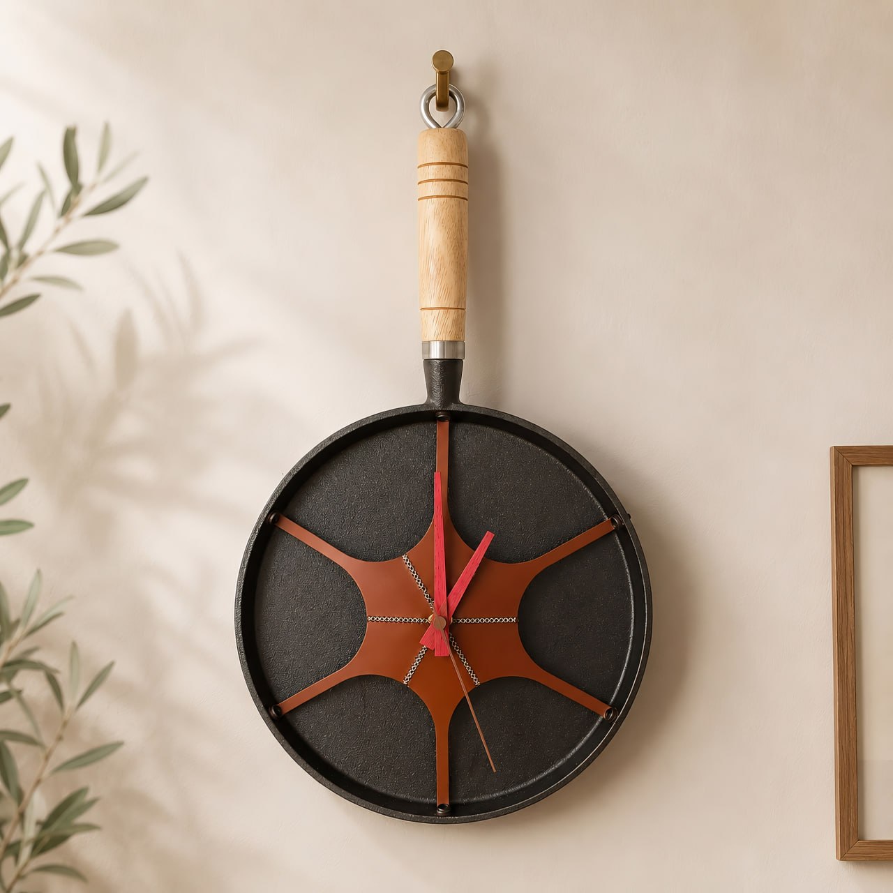 pan wall clock hanging on textured wall