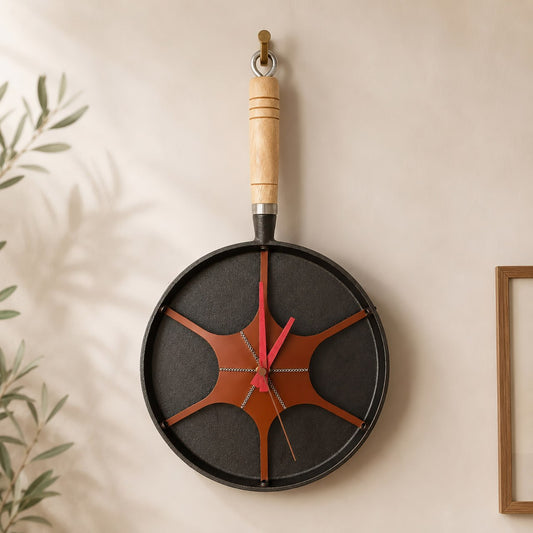 pan wall clock hanging on textured wall